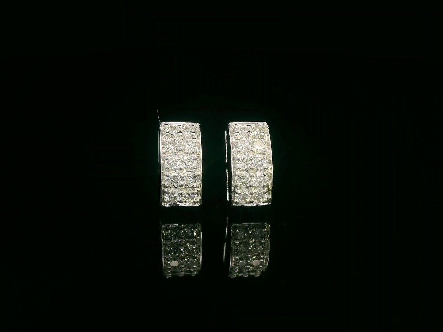 18K white gold pavé diamond bar stud earrings – minimalist curved design with 0.28ct diamonds by Emirates Diamonds.