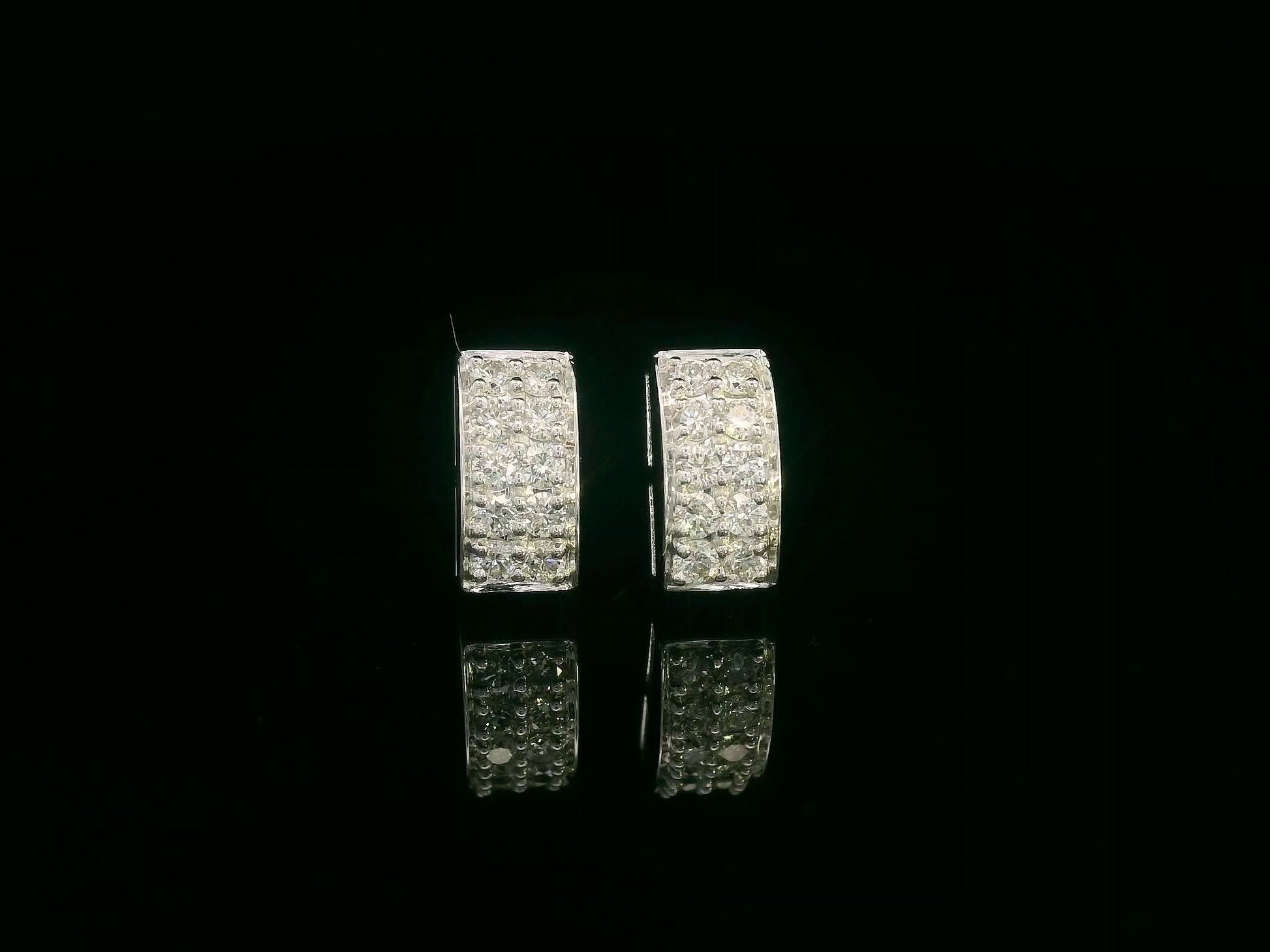 18K white gold pavé diamond bar stud earrings – minimalist curved design with 0.28ct diamonds by Emirates Diamonds.