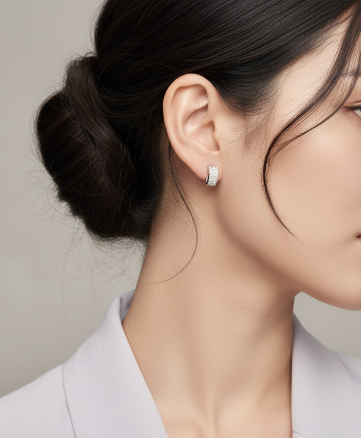 18K white gold pavé diamond bar stud earrings – minimalist curved design with 0.28ct diamonds by Emirates Diamonds.