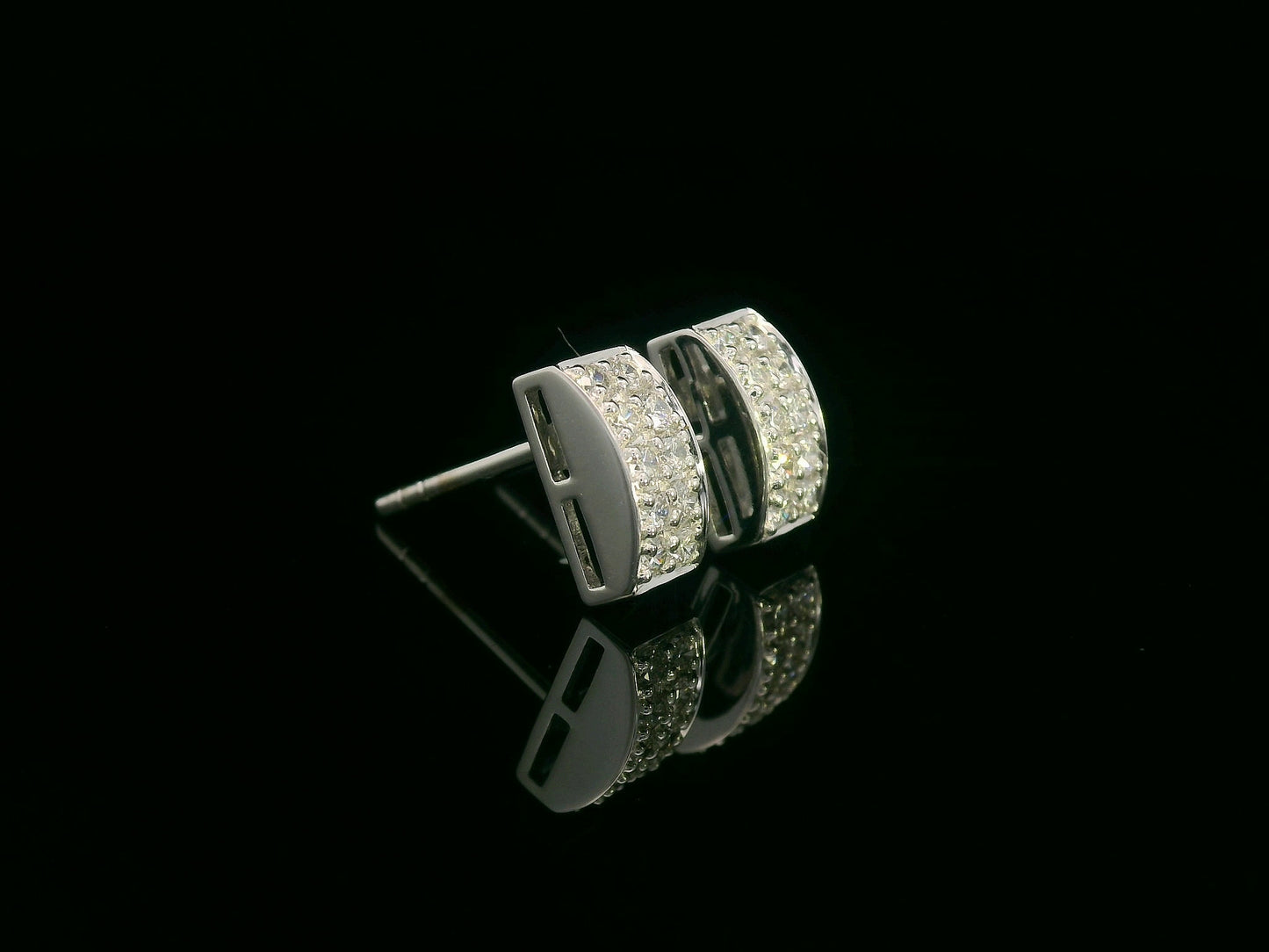 18K white gold pavé diamond bar stud earrings – minimalist curved design with 0.28ct diamonds by Emirates Diamonds.