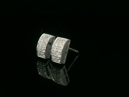 18K white gold pavé diamond bar stud earrings – minimalist curved design with 0.28ct diamonds by Emirates Diamonds.
