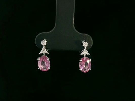 18K white gold pink sapphire and diamond drop earrings – oval pink sapphires with pavé diamond accents, elegant dangling design by Emirates Diamonds.