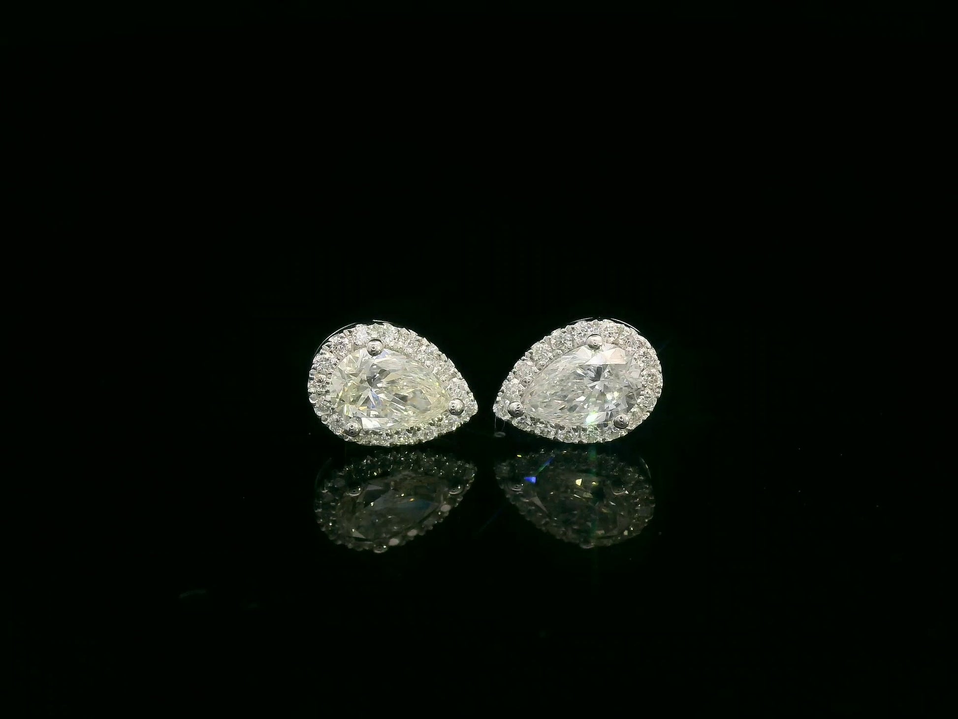 Pear-shaped diamond halo stud earrings in 18K white gold — Emirates Diamonds