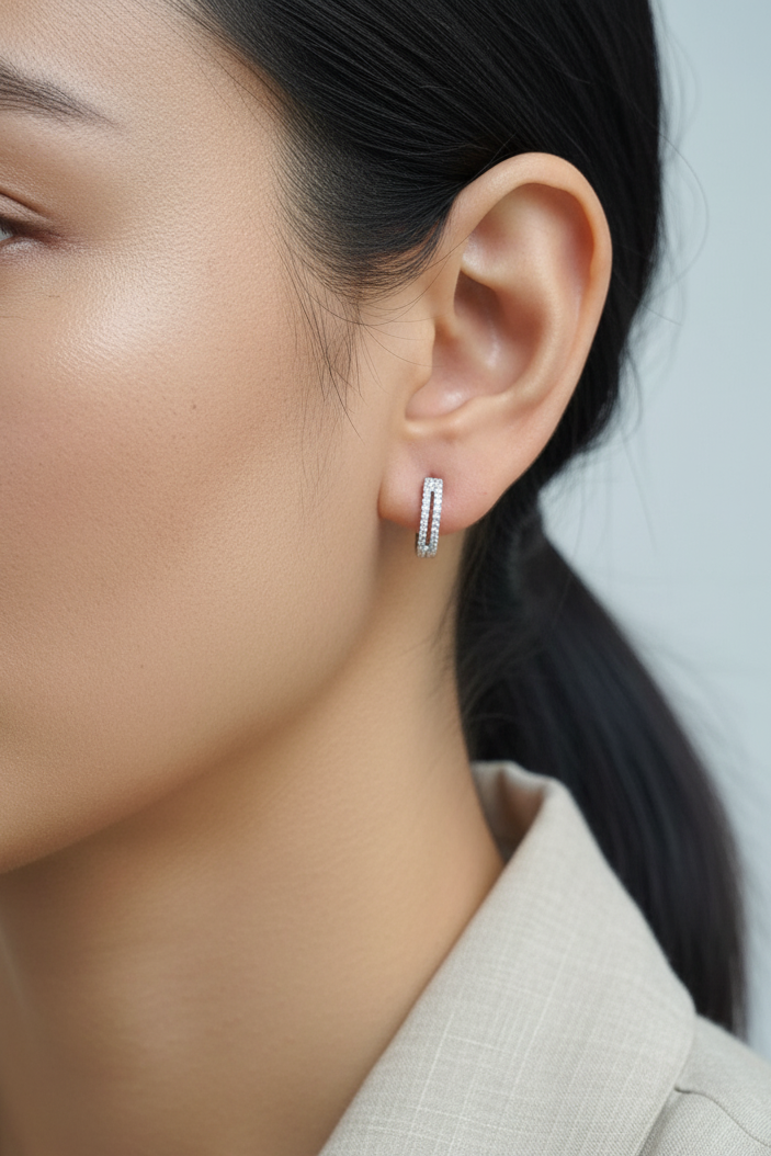 18K white gold diamond huggie hoop earrings – 0.23ct pavé diamonds by Emirates Diamonds