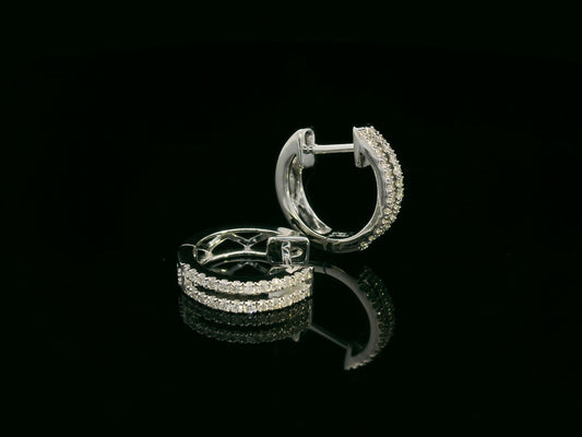 18K white gold diamond huggie hoop earrings – 0.23ct pavé diamonds by Emirates Diamonds