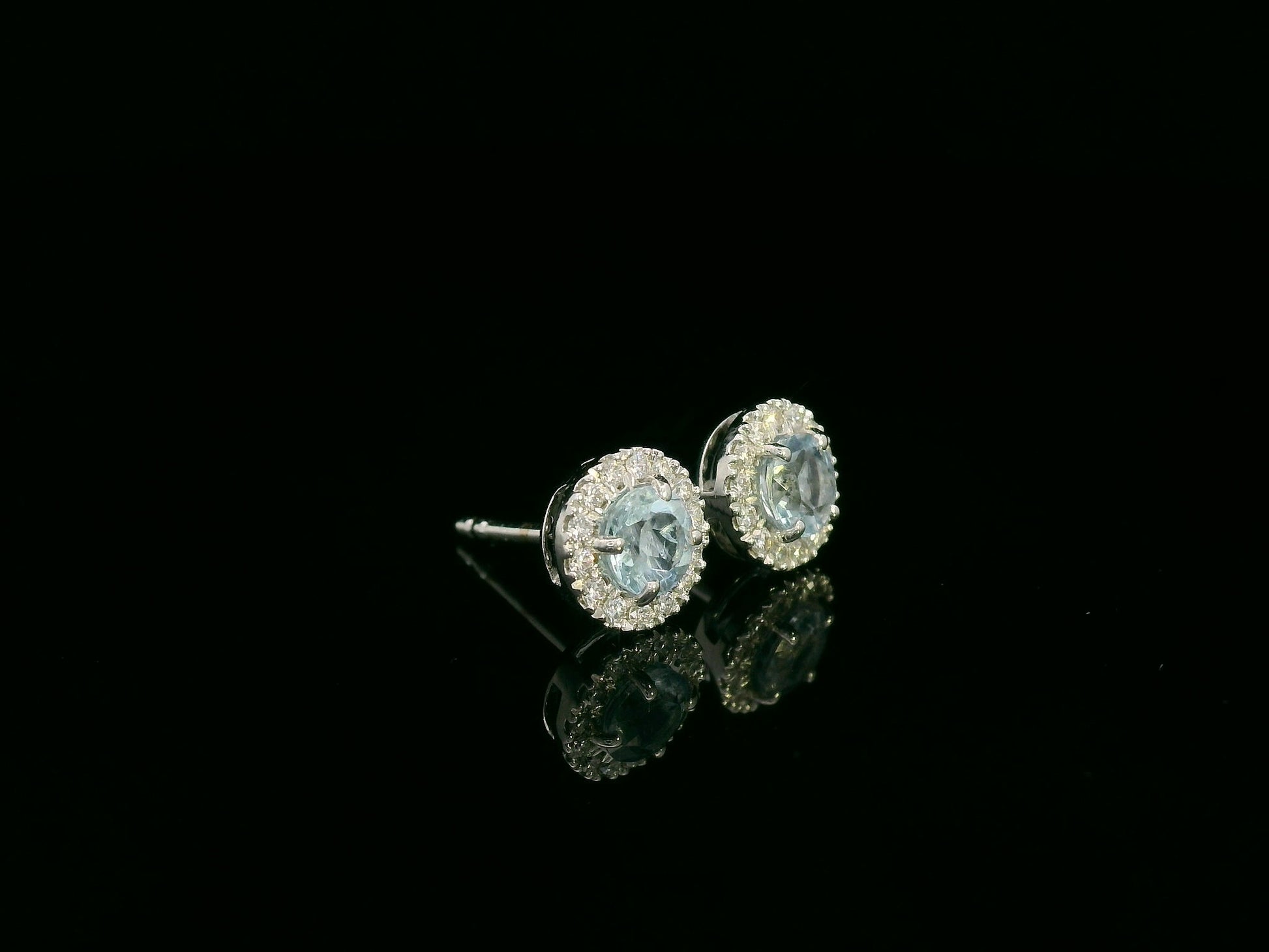 18K white gold aquamarine and diamond halo stud earrings, 0.48ct aquamarine and 0.13ct diamonds – Emirates Diamonds