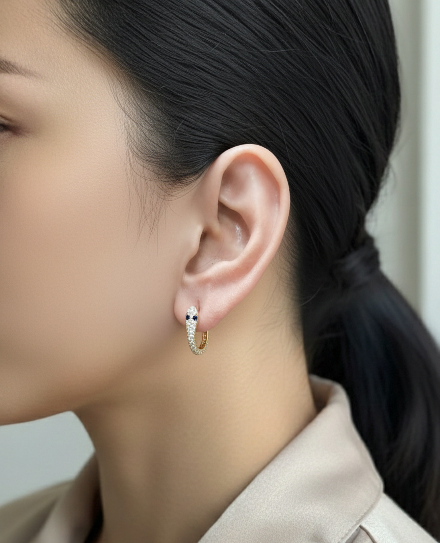 18K yellow gold serpent-inspired hoop earrings with pavé diamonds and blue sapphires – Emirates Diamonds