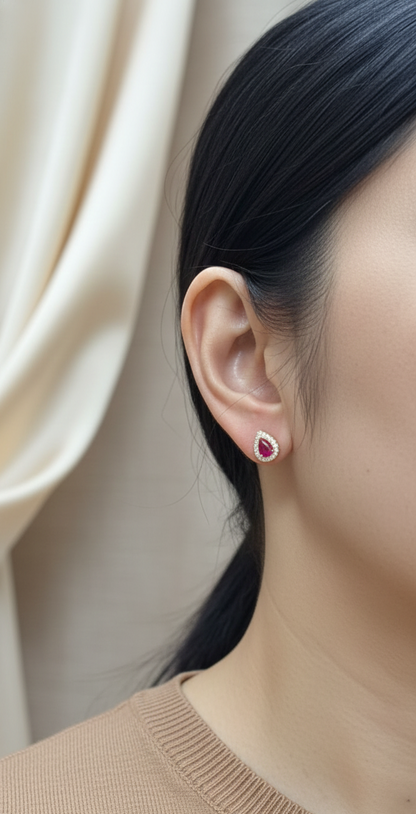 18K yellow gold ruby stud earrings with pear-shaped 1.58ct rubies and 0.28ct diamond halos – Emirates Diamonds