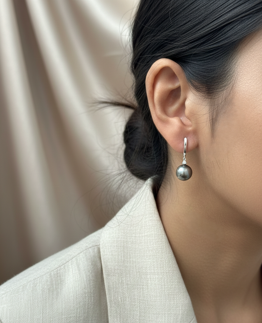 18K white gold Tahitian black pearl drop earrings with diamond accents, luxury pearl fine jewelry by Emirates Diamonds.