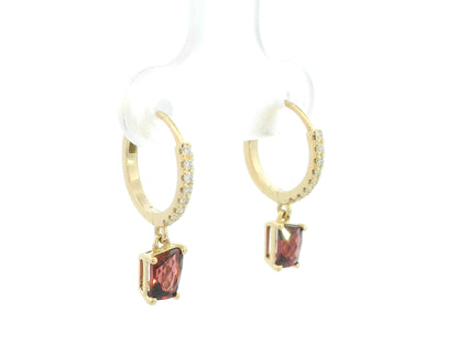 18K yellow gold hoop earrings with natural garnet drops and diamond accents, elegant fine jewelry by Emirates Diamonds.