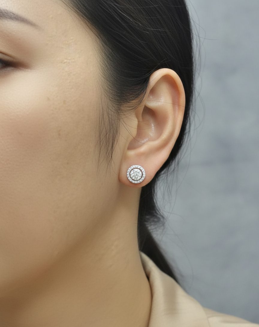 18K white gold diamond halo stud earrings with round cluster design and 1.05 carat total diamond weight by Emirates Diamonds