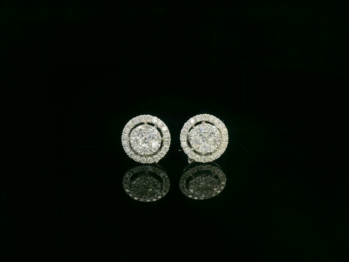 18K white gold diamond halo stud earrings with round cluster design and 1.05 carat total diamond weight by Emirates Diamonds