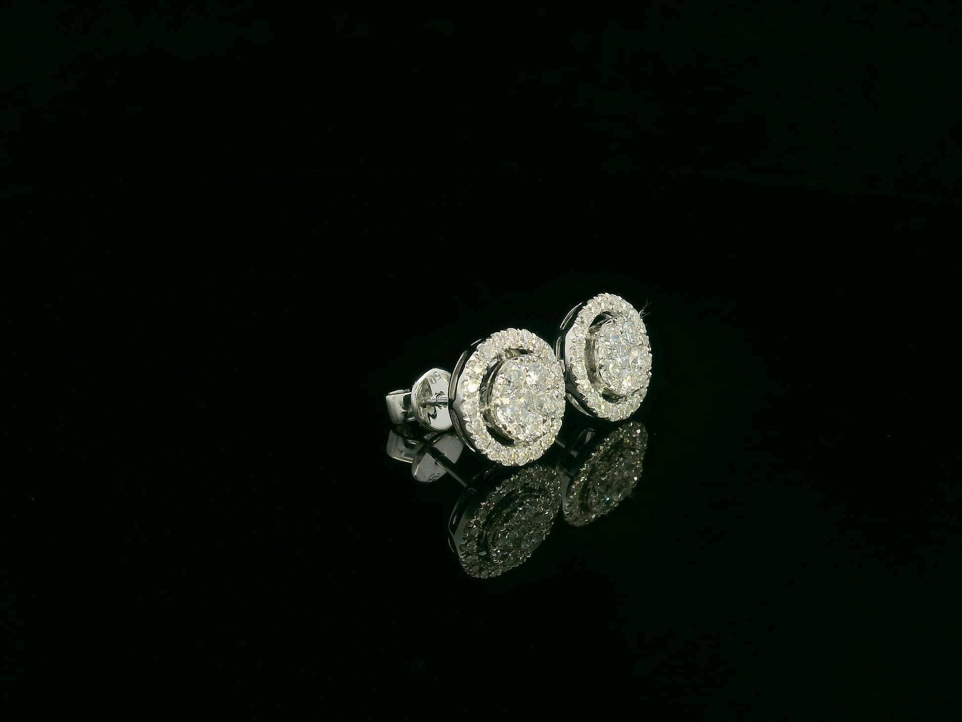 18K white gold diamond halo stud earrings with round cluster design and 1.05 carat total diamond weight by Emirates Diamonds