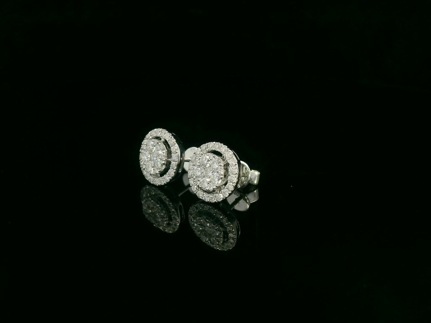 18K white gold diamond halo stud earrings with round cluster design and 1.05 carat total diamond weight by Emirates Diamonds