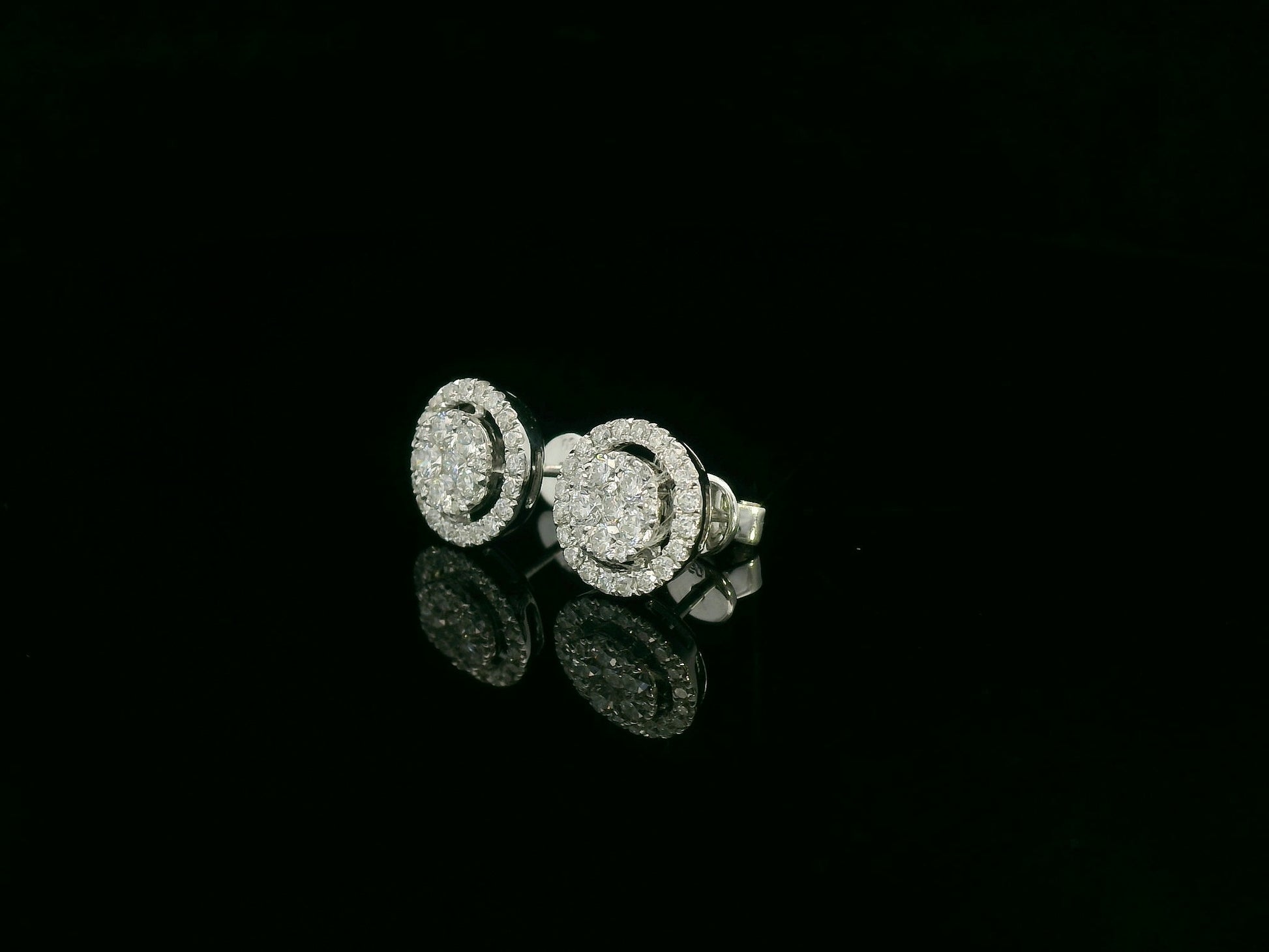 18K white gold diamond halo stud earrings with round cluster design and 1.05 carat total diamond weight by Emirates Diamonds