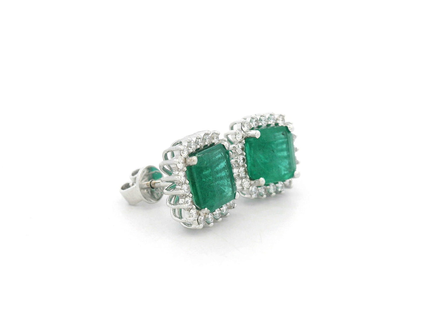 18K white gold emerald and diamond halo stud earrings with square-cut emeralds and brilliant diamond accents by Emirates Diamonds