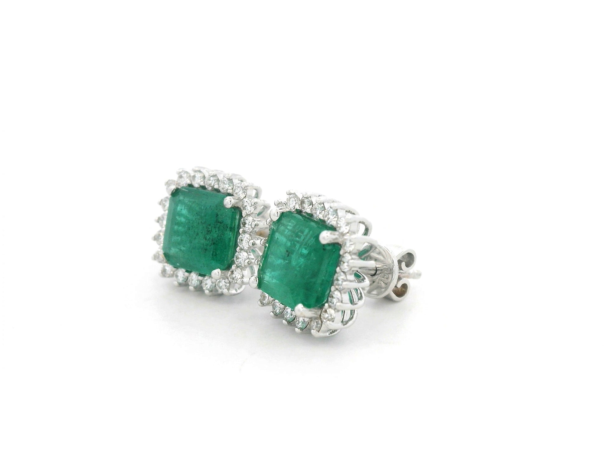 18K white gold emerald and diamond halo stud earrings with square-cut emeralds and brilliant diamond accents by Emirates Diamonds