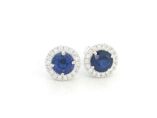 18K white gold blue sapphire and diamond halo stud earrings with round sapphires, 1.40 carat sapphires and 0.20 carat diamonds by Emirates Diamonds