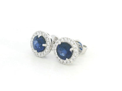 18K white gold blue sapphire and diamond halo stud earrings with round sapphires, 1.40 carat sapphires and 0.20 carat diamonds by Emirates Diamonds