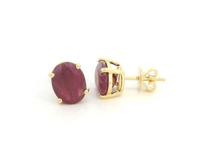 18K yellow gold ruby stud earrings featuring oval-cut natural rubies totaling 5.19 carats by Emirates Diamonds.