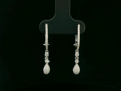 18K white gold diamond drop earrings with pavé-set hoop design and dangling teardrop diamonds by Emirates Diamonds