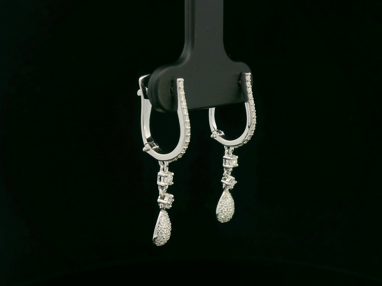 18K white gold diamond drop earrings with pavé-set hoop design and dangling teardrop diamonds by Emirates Diamonds