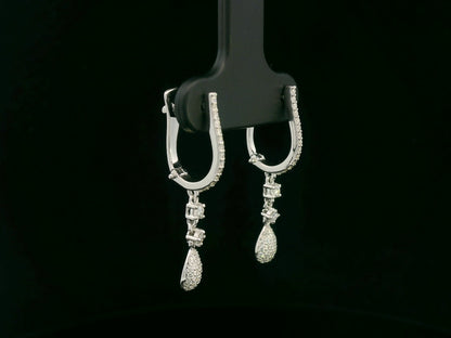 18K white gold diamond drop earrings with pavé-set hoop design and dangling teardrop diamonds by Emirates Diamonds