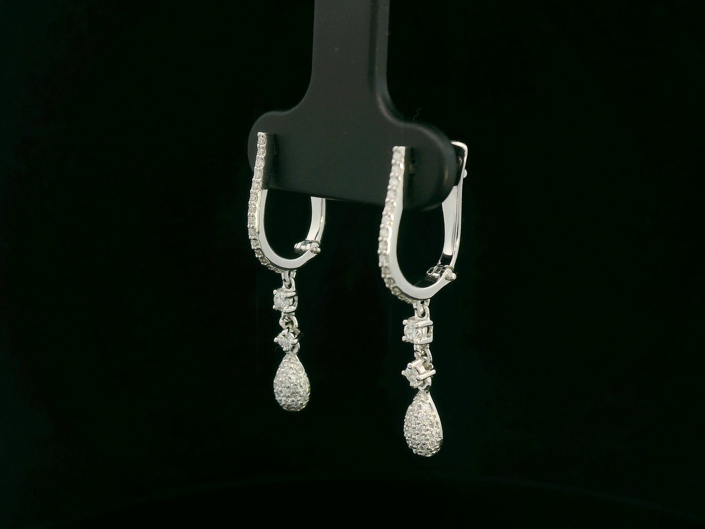 18K white gold diamond drop earrings with pavé-set hoop design and dangling teardrop diamonds by Emirates Diamonds