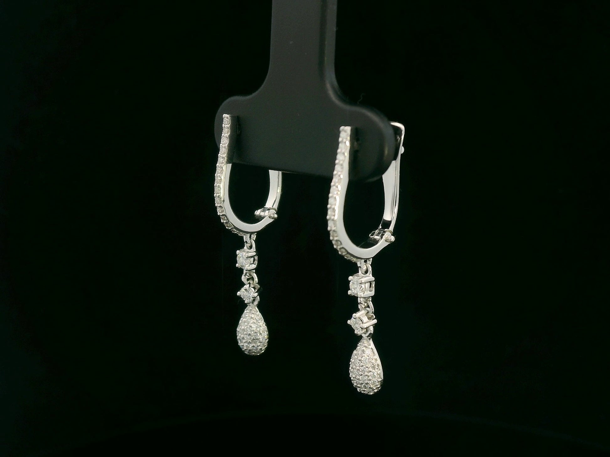 18K white gold diamond drop earrings with pavé-set hoop design and dangling teardrop diamonds by Emirates Diamonds