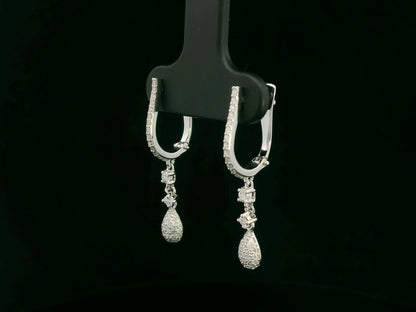 18K white gold diamond drop earrings with pavé-set hoop design and dangling teardrop diamonds by Emirates Diamonds