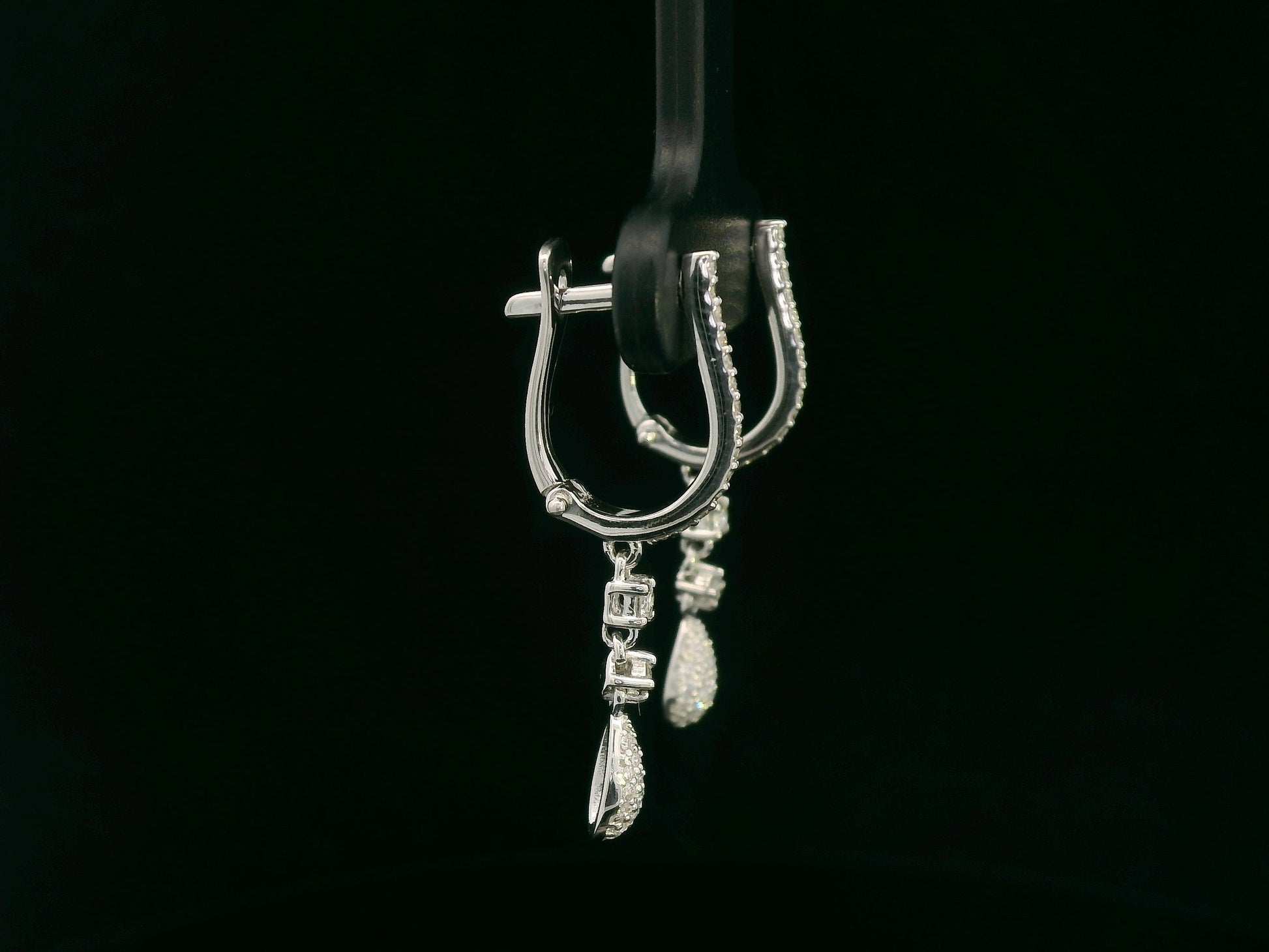 18K white gold diamond drop earrings with pavé-set hoop design and dangling teardrop diamonds by Emirates Diamonds