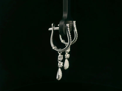 18K white gold diamond drop earrings with pavé-set hoop design and dangling teardrop diamonds by Emirates Diamonds