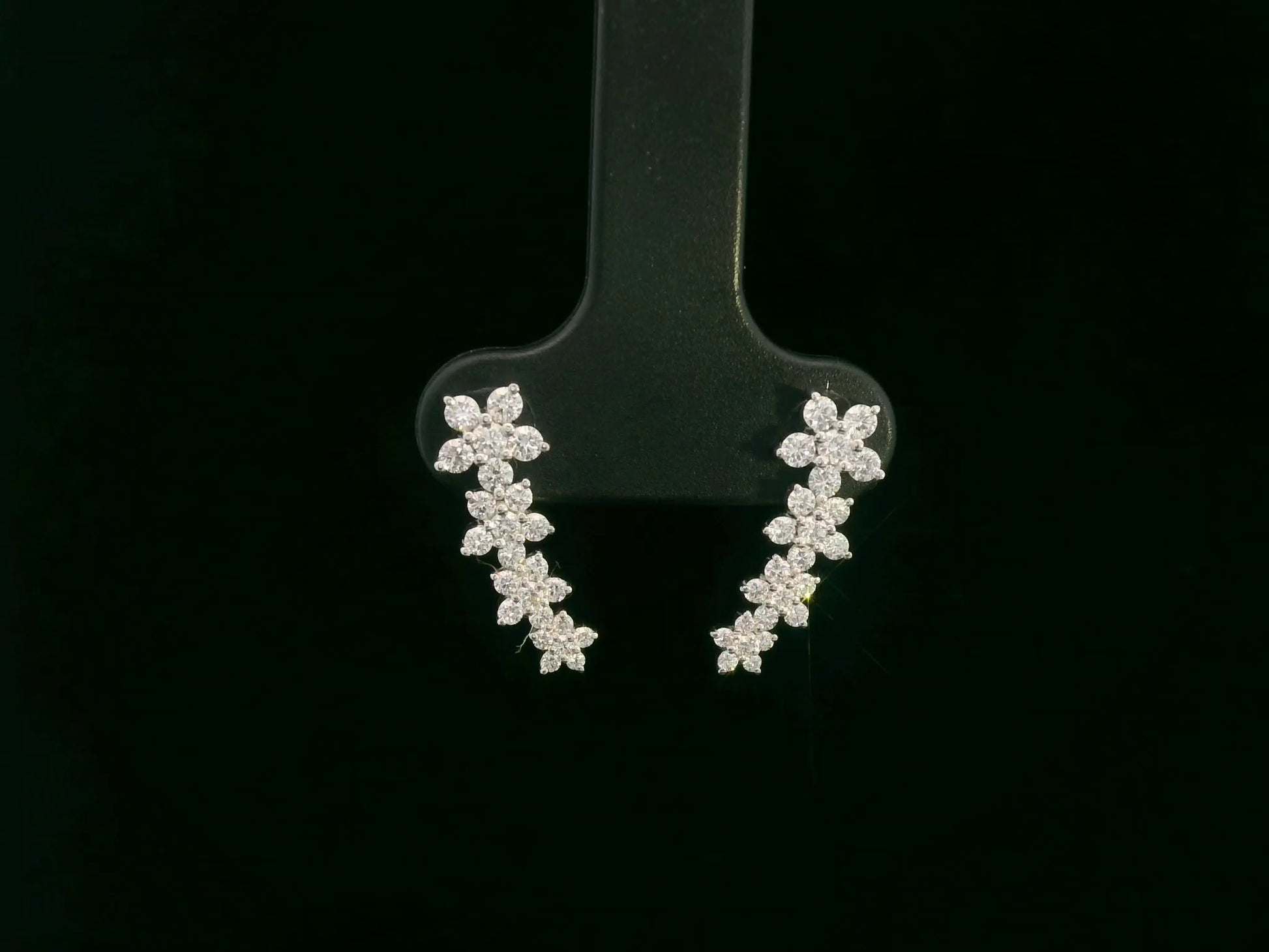 Diamond floral stud earrings in 18K white gold with 0.54 carat total diamond weight by Emirates Diamonds