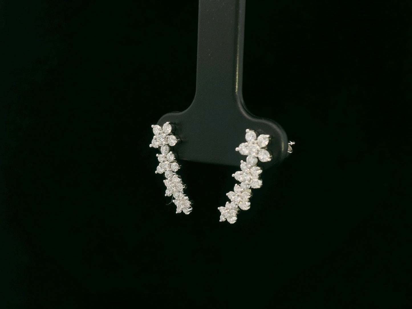 Diamond floral stud earrings in 18K white gold with 0.54 carat total diamond weight by Emirates Diamonds
