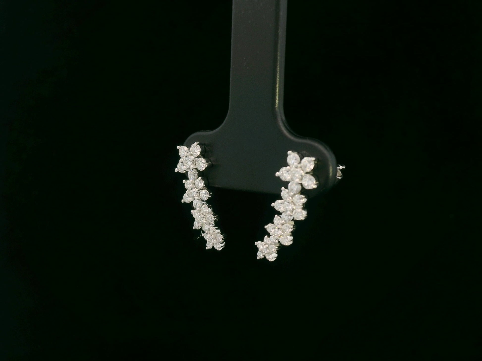 Diamond floral stud earrings in 18K white gold with 0.54 carat total diamond weight by Emirates Diamonds