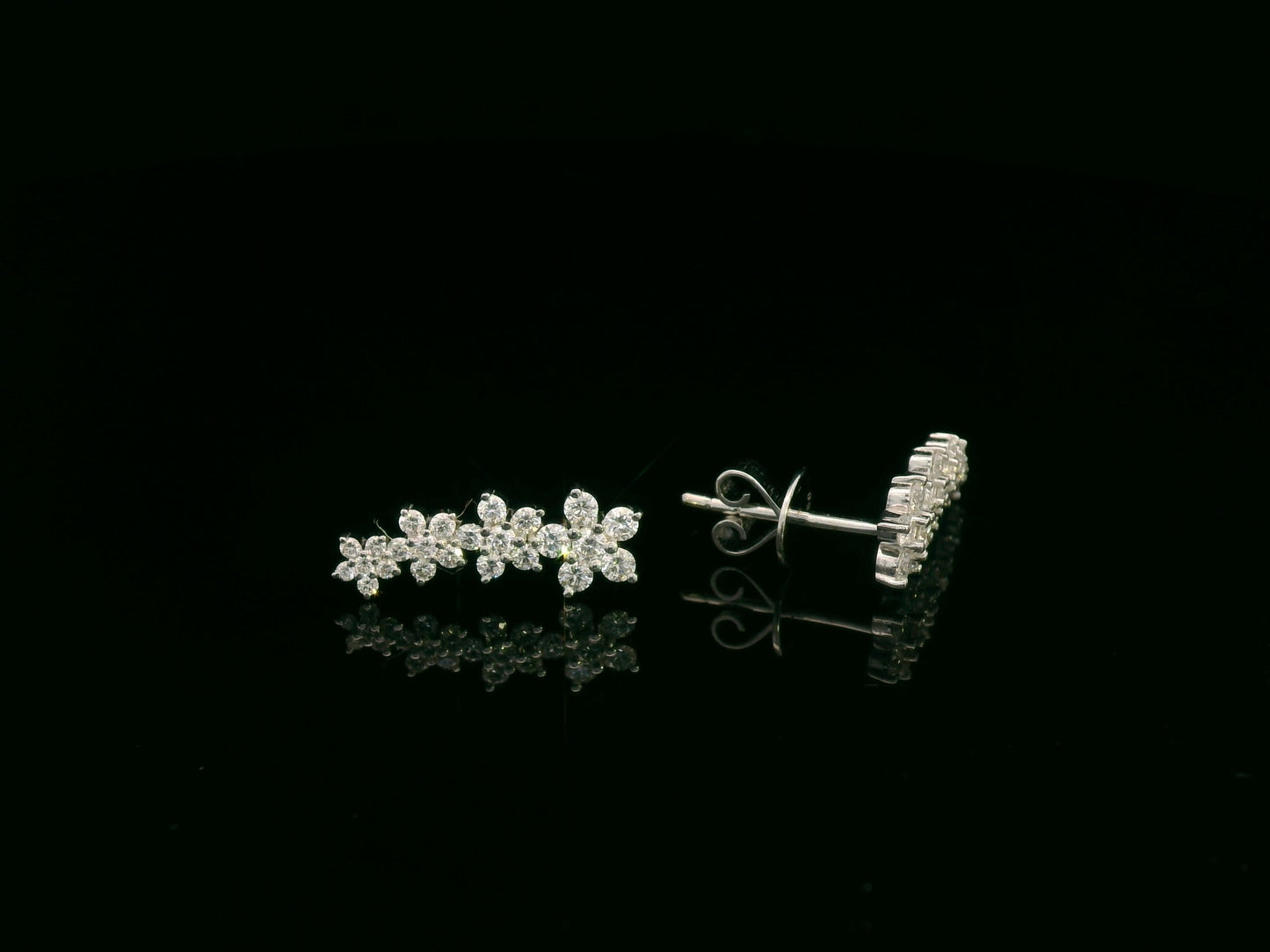 Diamond floral stud earrings in 18K white gold with 0.54 carat total diamond weight by Emirates Diamonds