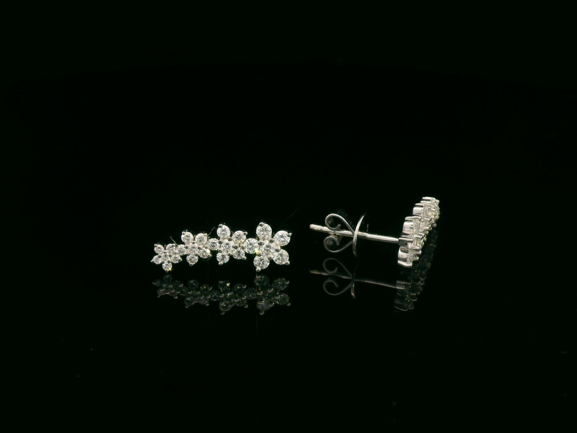 Diamond floral stud earrings in 18K white gold with 0.54 carat total diamond weight by Emirates Diamonds