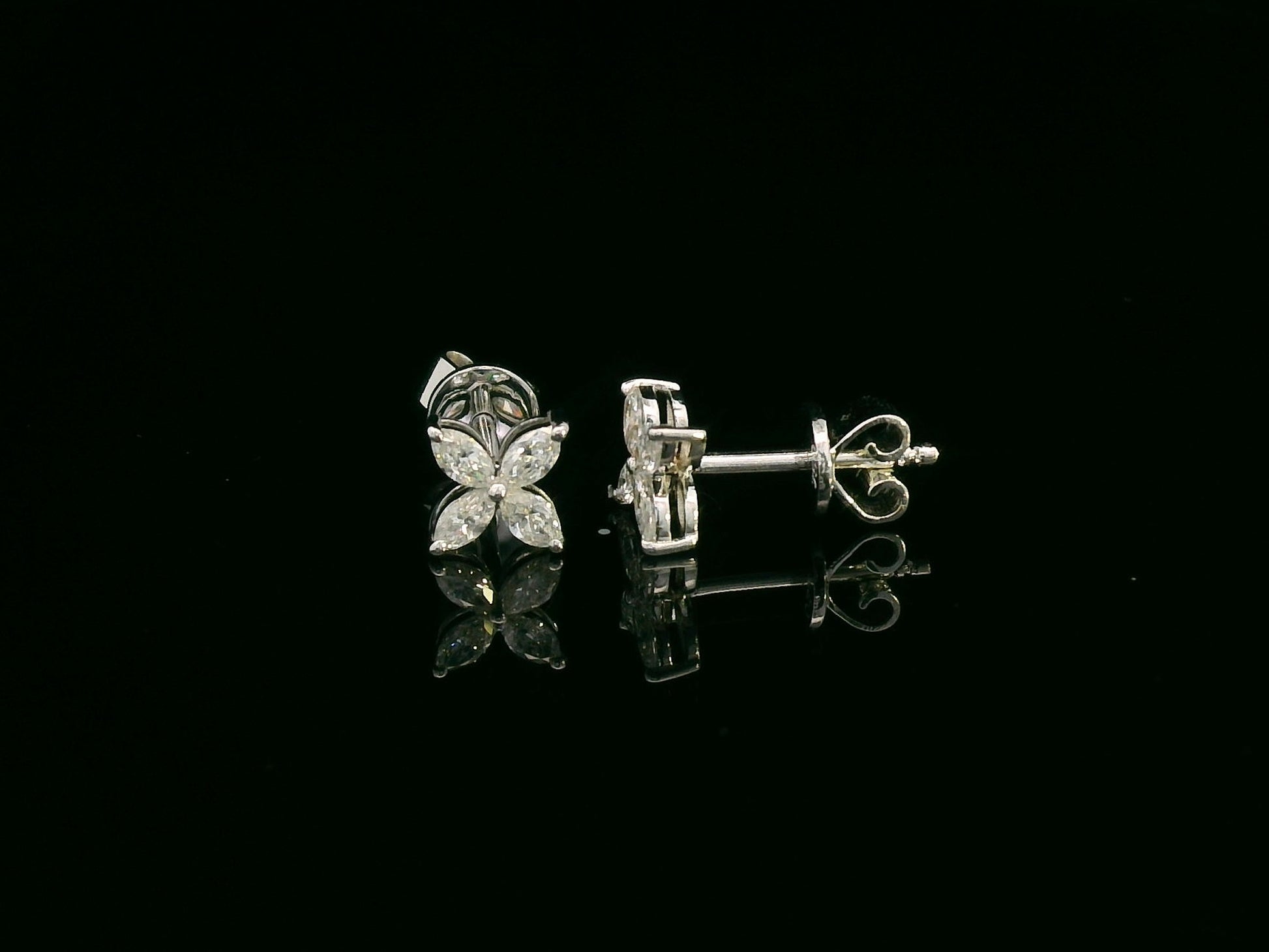 Diamond floral stud earrings in 18K white gold with marquise-cut diamonds totaling 0.34 carat by Emirates Diamonds