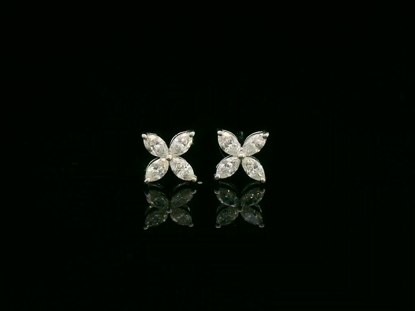 Diamond floral stud earrings in 18K white gold with marquise-cut diamonds totaling 0.34 carat by Emirates Diamonds