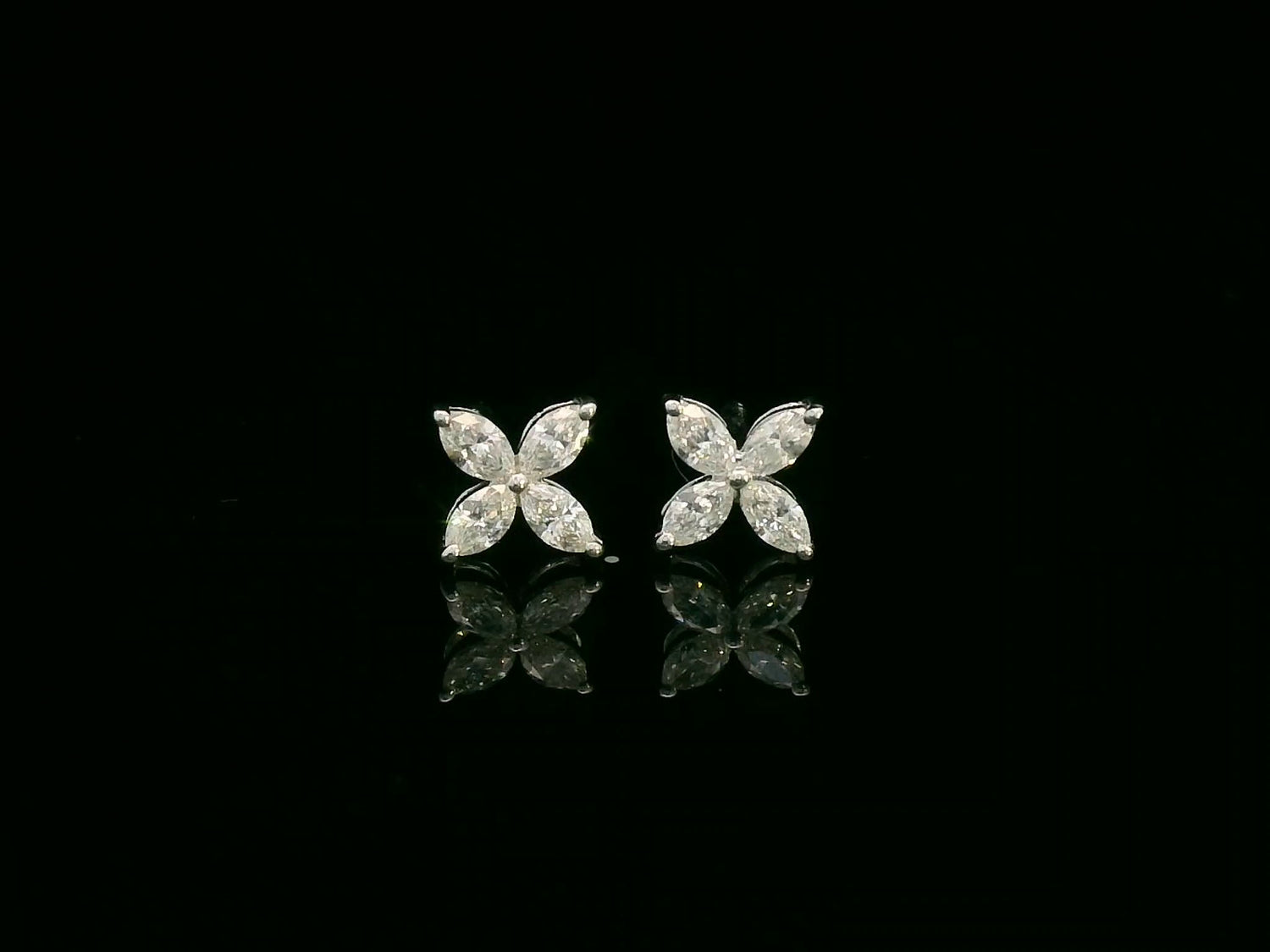 Diamond floral stud earrings in 18K white gold with marquise-cut diamonds totaling 0.34 carat by Emirates Diamonds