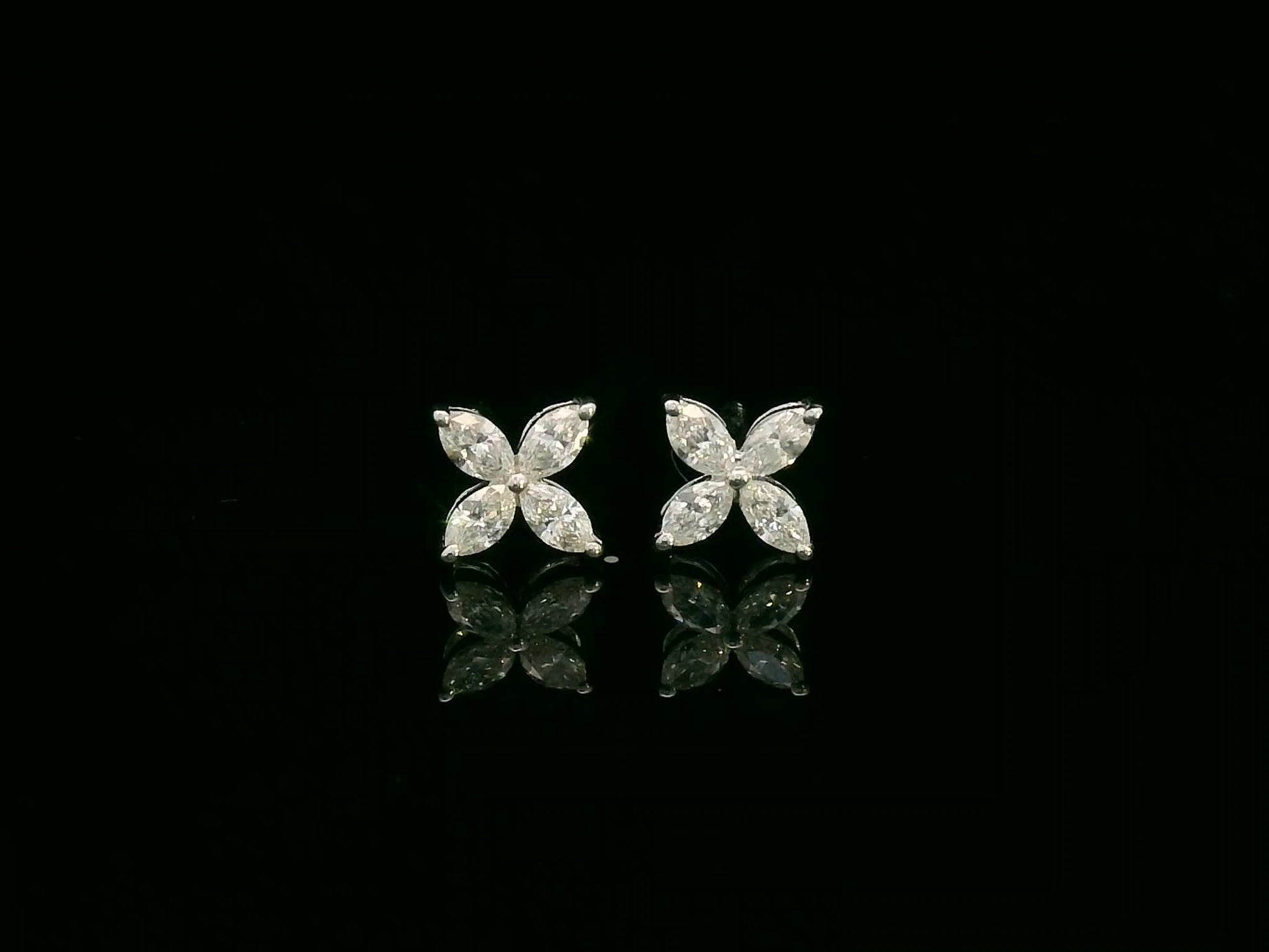 Diamond floral stud earrings in 18K white gold with marquise-cut diamonds totaling 0.34 carat by Emirates Diamonds