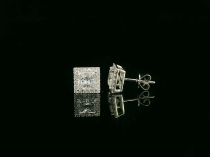 Princess cut diamond halo stud earrings in 18K white gold featuring GIA certified 1.01 carat E color VS2 diamonds with halo accents by Emirates Diamonds