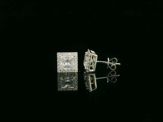 Princess cut diamond halo stud earrings in 18K white gold featuring GIA certified 1.01 carat E color VS2 diamonds with halo accents by Emirates Diamonds