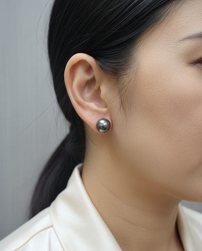 Tahitian black pearl stud earrings in 18K white gold featuring South Sea pearls by Emirates Diamonds