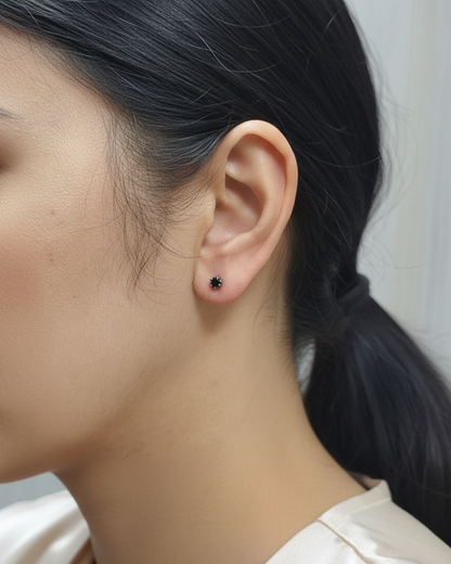 Black diamond stud earrings in 18K white gold with round-cut diamonds by Emirates Diamonds