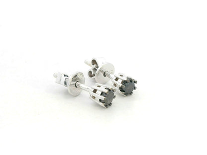 Black diamond stud earrings in 18K white gold with round-cut diamonds by Emirates Diamonds