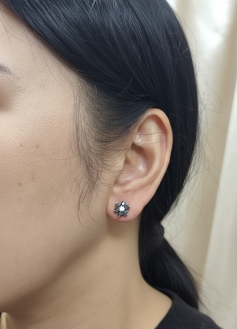 Black and white diamond floral stud earrings in 18K white gold with 1.27 carat total diamond weight by Emirates Diamonds