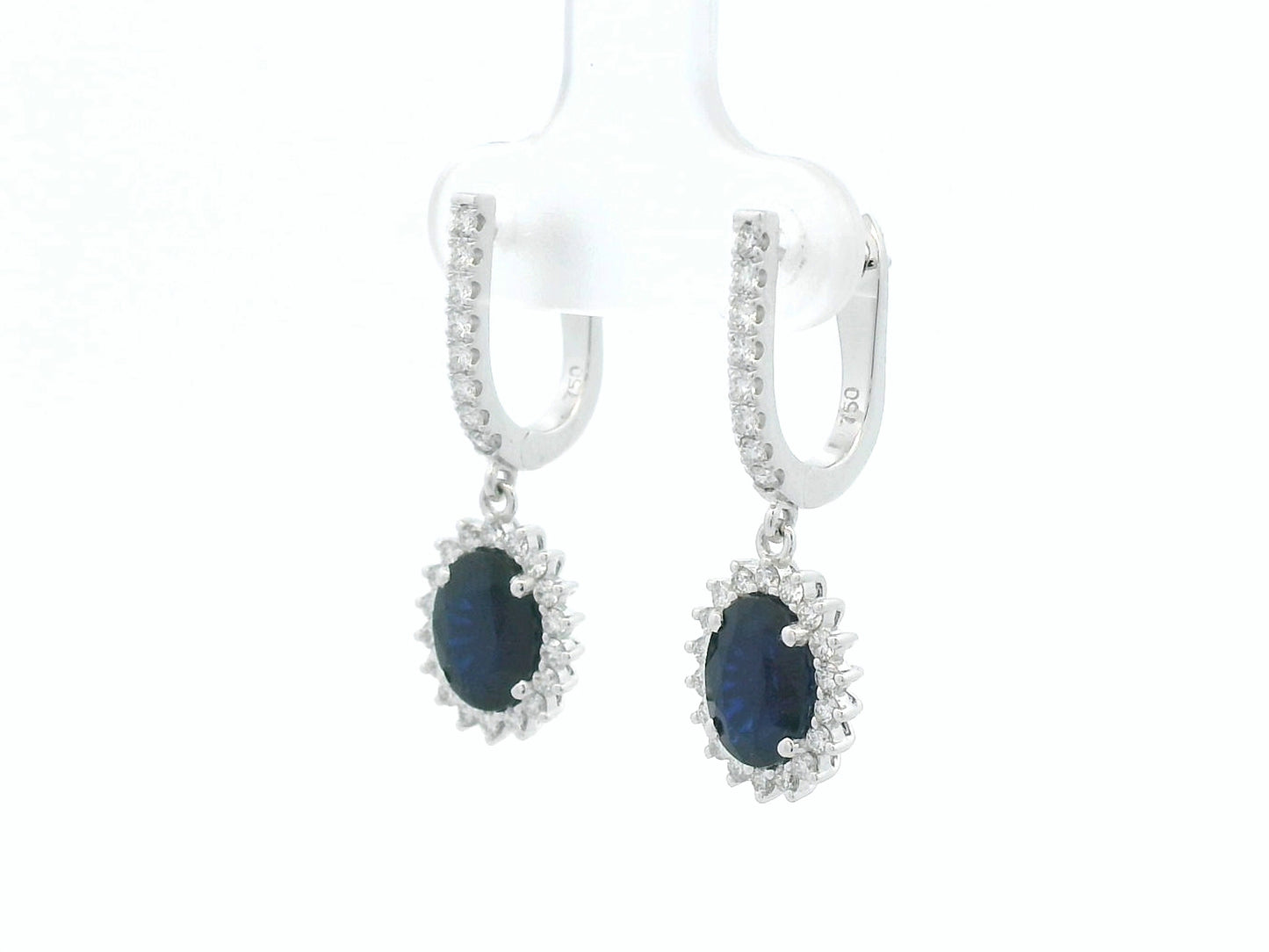 18K white gold sapphire and diamond drop earrings with oval sapphire halos by Emirates Diamonds