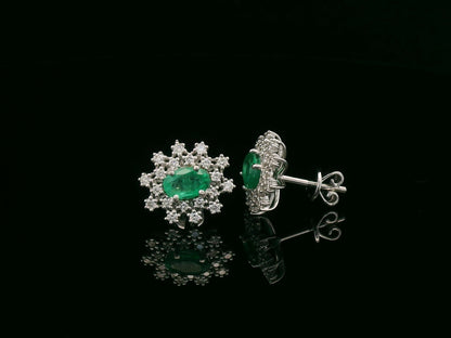 18K white gold emerald and diamond stud earrings with oval emerald center by Emirates Diamonds