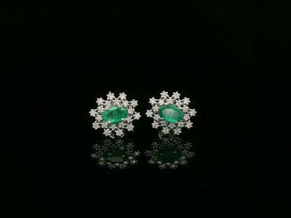 18K white gold emerald and diamond stud earrings with oval emerald center by Emirates Diamonds